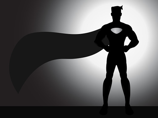Superhero silhoutted against a bright aura